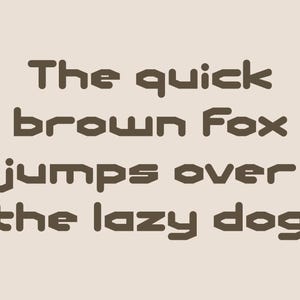May include: A beige background with the phrase "The quick brown Fox jumps over the lazy dog" in a brown, blocky font. A small circular logo in the upper right corner reads "Studio Basics".