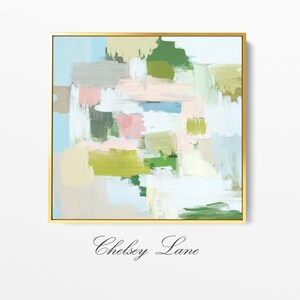May include: Abstract art print in a gold frame. The artwork features brushstrokes in shades of green, pink, blue, and beige. The text "Chelsey Lane" is at the bottom of the frame.
