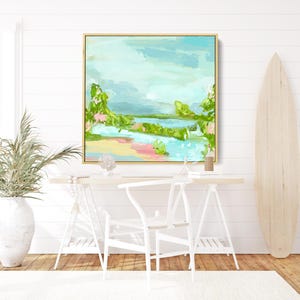 May include: Abstract landscape painting with a light blue, green, and pink color scheme. The painting depicts a scene with water, trees, and a sandy beach.