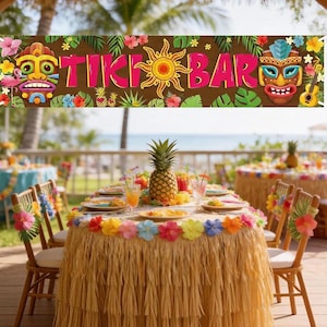 May include: A festive Tiki Bar banner with colorful floral and tribal mask designs. A table is set with a pineapple centerpiece, drinks, and plates. The table is decorated with a raffia skirt and flower garland, creating a tropical theme.
