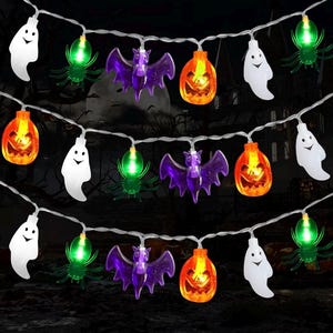 May include: A string of Halloween-themed LED lights featuring white ghost shapes, green spiders, purple bats, and orange jack-o'-lanterns. The decorative lights are connected by a thin white wire and emit a glowing light from within each figure.
