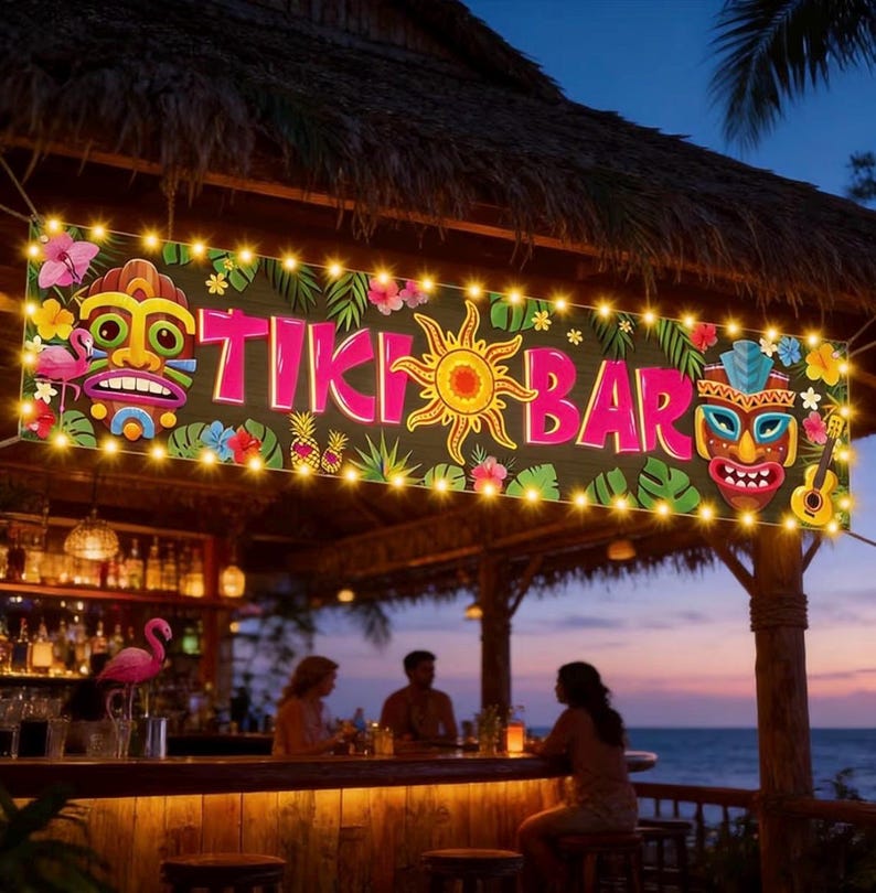 May include: A banner reading "TIKI BAR" with tropical illustrations and string lights. The banner features a sun, flowers, and tiki masks. The bar is open with patrons seated at the bar, with a pink flamingo statue on the bar.
