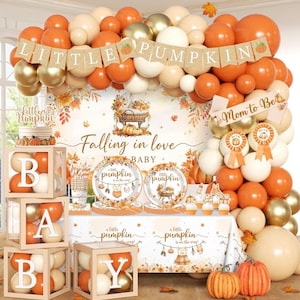 May include: A baby shower party set featuring an orange, white, and gold balloon arch, a banner reading LITTLE PUMPKIN, and a table with plates and a tablecloth printed with Falling in love with a little pumpkin and baby clothes graphics.