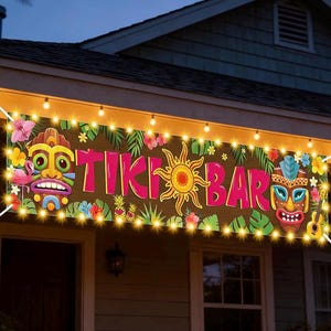 May include: A banner with the words "TIKI BAR" in pink letters, decorated with tropical flowers, tiki masks, and a sun design. The banner is illuminated by string lights, creating a festive atmosphere.
