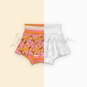 May include: A pair of pink and orange baby bloomers with a heart and butterfly pattern. The bloomers have a white ruffle around the bottom.