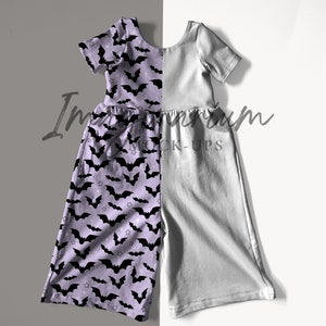 Könnte beinhalten: Ein lila-graues, ärmelloses Kleid mit einem Fledermaus-Druck auf der einen Seite und einer einfarbigen grauen Farbe auf der anderen Seite. Das Kleid hat eine geraffte Taille und kurze Ärmel.