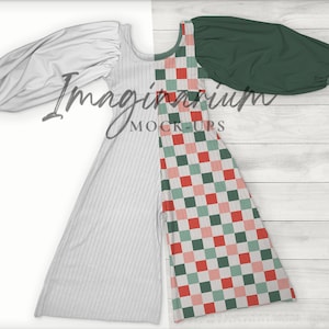 May include: A white and green checked dress with a white long-sleeved top and green long-sleeved top. The dress has a gathered neckline and a loose fit.