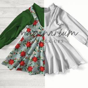 May include: A green long-sleeved shirt with a white dress with a red and white floral pattern. The dress has a ruffled hem and is layered over the shirt.