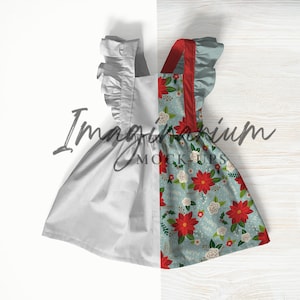 Puede incluir: Un vestido blanco sin mangas con estampado floral rojo y azul. El vestido tiene un escote con volantes y tirantes. El vestido está sobre un fondo blanco y de madera.