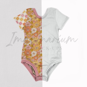 May include: A short-sleeved baby bodysuit, split vertically. One side features a floral pattern in shades of orange, yellow, and pink, with a checkered sleeve. The other side is plain white. The bodysuit has a pink trim.