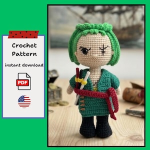 May include: Crocheted doll with green hair, a green jacket, and black boots. The doll has a red sash and three swords. The image includes text that says "Crochet Pattern instant download PDF".