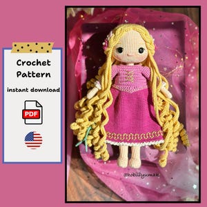 May include: A handmade crochet doll with long, curly blonde hair and a pink dress. The doll has a detailed face with black eyes and a small nose. The image includes text that says "Crochet Pattern instant download" and a PDF icon.