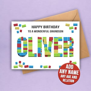 May include: A birthday card with the name "OLIVER" spelled out in colorful toy blocks. The card reads "HAPPY BIRTHDAY TO A WONDERFUL GRANDSON." A red circle states "ADD ANY NAME ANY AGE AND RELATION."