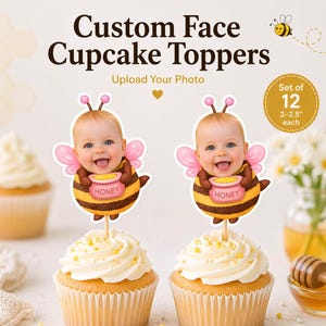 May include: Custom face cupcake toppers featuring a baby dressed as a bee. The toppers are on cupcakes with white frosting. The image includes the text "Custom Face Cupcake Toppers" and "Upload Your Photo". The set includes 12 toppers, each 2-2.5 inches.