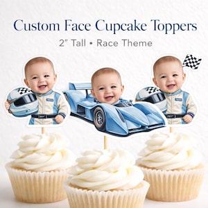 May include: Custom face cupcake toppers with a race theme. The toppers are 2 inches tall and feature a baby's face, a blue race car, and a checkered flag. The cupcakes have white frosting.