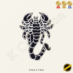 May include: Black and white embroidered scorpion patch with a white outline. The patch is 5.5 cm by 7.8 cm.