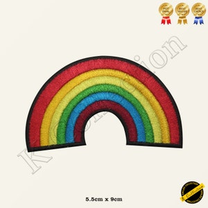 May include: A colourful rainbow patch with red, orange, yellow, green, blue, indigo, and violet stripes. The patch is 5.5 cm by 9 cm.