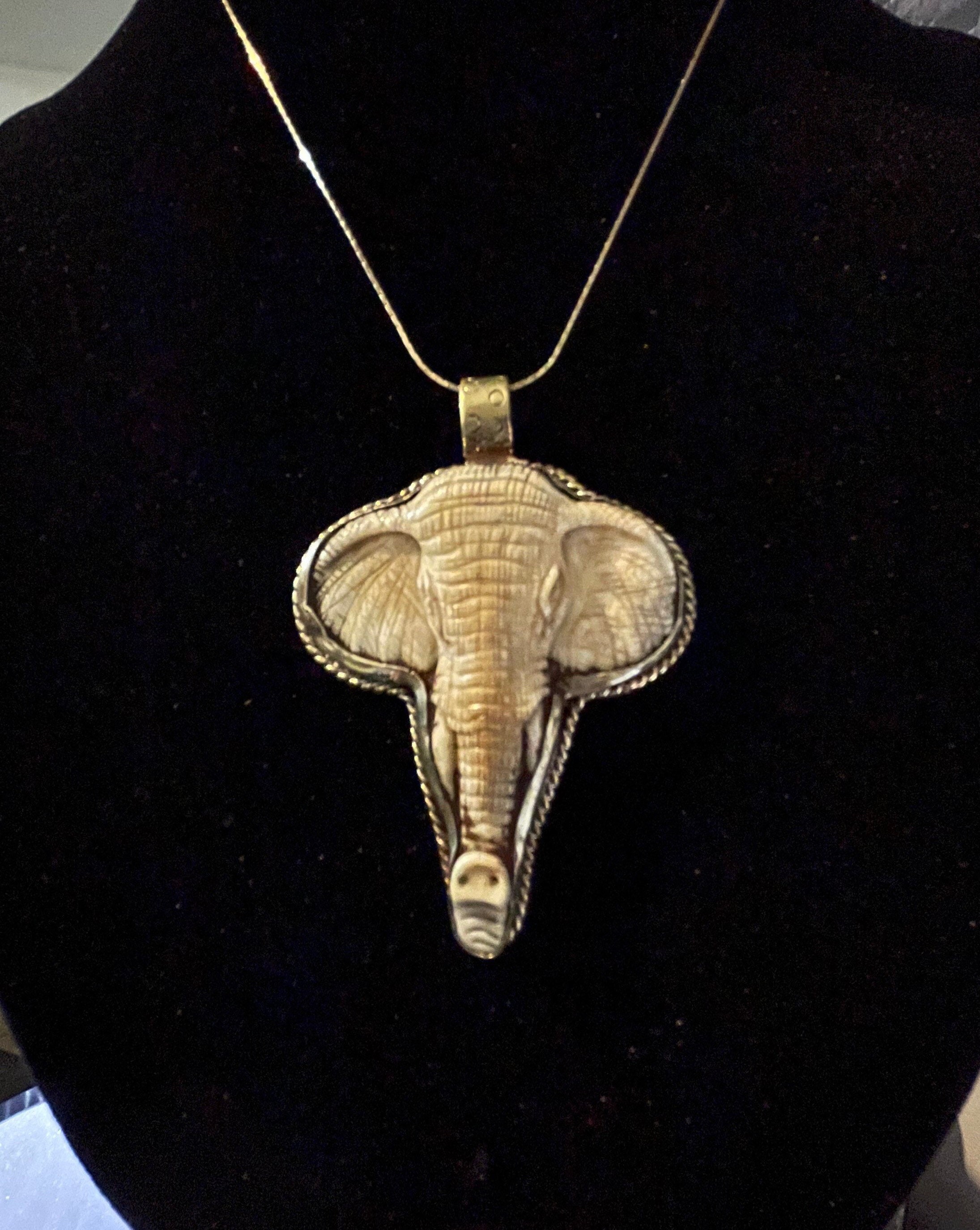 Gold elephant deals head pendant