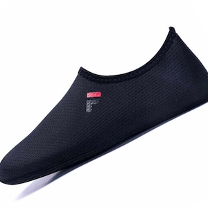 May include: Black mesh water shoes with a red and white logo that says "Fila" on the side.