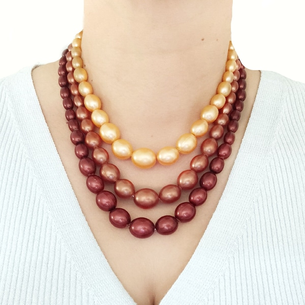 c1950s West German Necklace. 3 Strand Vintage Plastic Faux Pearl Costume Jewellery. Signed. Burgundy, Bronze, Pale Golden Colouration. As Is