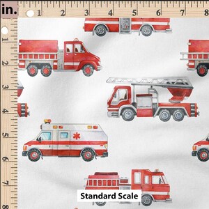 May include: A white fabric with a repeating pattern of red fire trucks and an ambulance. The fire trucks have ladders and hoses. The ambulance has a red cross on the side. The fabric is measured in inches.