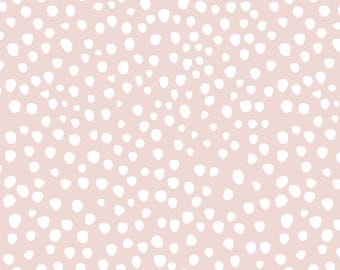 May include: A seamless pattern with a light pink background and white polka dots of varying sizes.