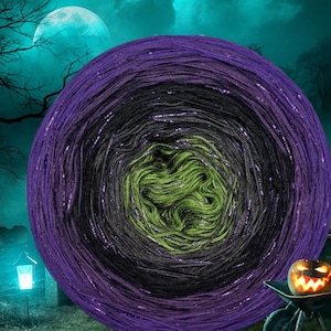 May include: A large ball of yarn in a gradient of colours: purple, black, and green. The yarn has a metallic sheen, and the overall theme suggests a Halloween or spooky craft project. The background features a full moon and a jack-o'-lantern.