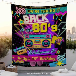 May include: A large black tapestry with a vibrant 80s theme. The design features a boombox, cassette tape, and the text "WE'RE TAKING IT BACK TO THE 80'S". Below, it reads "Welcome to Katty's 45th Birthday". The background is a cityscape.