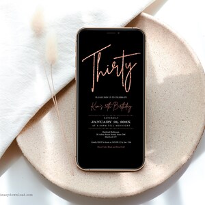 May include: A black smartphone mockup displaying a rose gold glitter birthday invitation with the text "Thirty" and "Kim's 30th Birthday". The invitation includes the date, time, and location of the event.