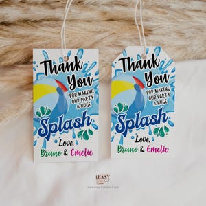 May include: Two blue and white thank you tags with a toucan and the word "Splash" in a colorful font. The text reads "Thank you for making our party a huge splash. Love, Bruno & Emelie."