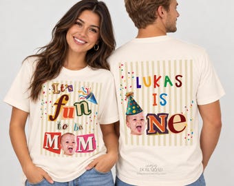 May include: Two cream-colored t-shirts featuring vertical stripes and colorful confetti. The left shirt displays the text "It's fun to be MOM" with a photo of a baby. The right shirt shows "LUKAS IS ONE" with a photo of a baby wearing a party hat.