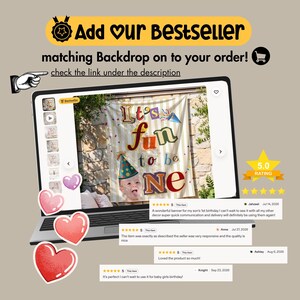 May include: A laptop screen displays a product listing for a birthday backdrop featuring the text It's fun to be ONE with a party hat graphic and a photo of a child. The screen shows five-star reviews and a shopping cart icon.