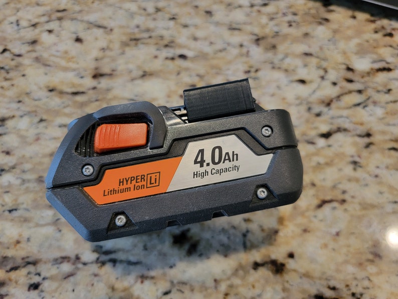 May include: A black and orange power tool battery with the text "HYPER Li Lithium Ion" and "4.0Ah High Capacity".