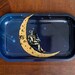 Moon Man Rolling Tray | Decorative Metal Tray with Astronaut Sitting on Crescent Moon in Space 