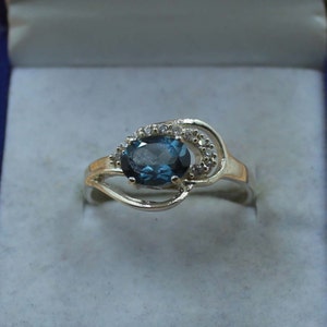 London Blue Topaz Ring: Oval Solitaire, Sterling Silver, December Birthstone