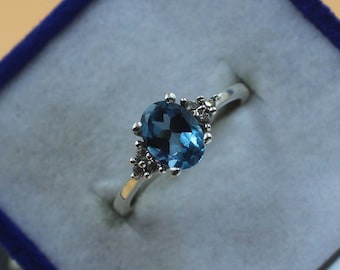 Oval London Blue Topaz Ring: Sterling Silver November Birthstone