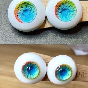 Pode incluir: Dois pares de olhos de boneca azuis, verdes, amarelos e laranja com esclera branca.