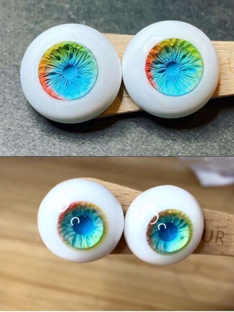 Pode incluir: Dois pares de olhos de boneca azuis, verdes, amarelos e laranja com esclera branca.