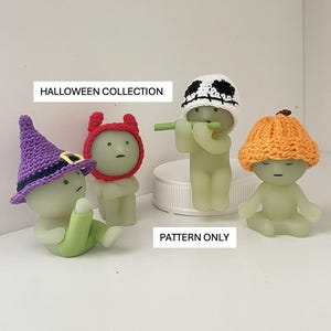 May include: A Halloween Collection featuring four small, glowing figurines. One wears a purple witch hat, another a red devil hat, a third a white skull cap, and the last an orange pumpkin hat. The text "Halloween Collection" and "Pattern Only" are visible.