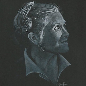 May include: A black and white drawing of a woman with short, grey hair pulled back in a ponytail. She is looking off to the side and has a serious expression on her face. The drawing is signed "James Hauck" in the bottom right corner.