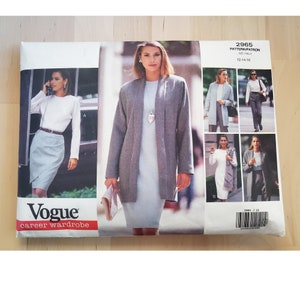 May include: Vogue career wardrobe pattern 2965 for sizes 12-14-16. The pattern includes a gray jacket, a gray dress, a white blouse, a gray skirt, and a white dress. The pattern is shown on a model wearing the different pieces.