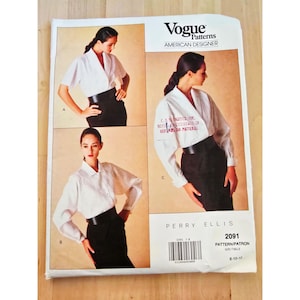 May include: Vogue Patterns American Designer sewing pattern featuring a Perry Ellis design. The pattern includes images of a woman wearing a white blouse and black skirt. The pattern number is 2091, and the size is 8-10-12.