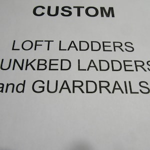 May include: A white sign with black text that reads "CUSTOM LOFT LADDERS BUNK BED LADDERS and GUARDRAILS".
