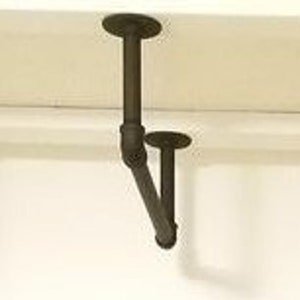 May include: Black metal shelf bracket with a 90-degree angle, attached to a white ceiling.