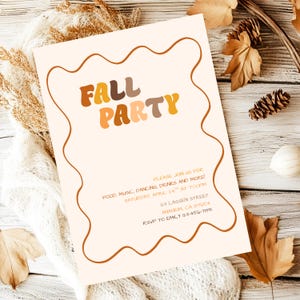 May include: A rectangular invitation card with a cream background and a wavy brown border. The text reads FALL PARTY in large, multi-coloured brown and orange letters. Below, smaller text provides event details including date, time, and location.