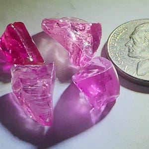 28.73 TCW Batch of Rough Pink Lav Created Ruby Crystals