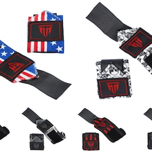 May include: Set of six wrist wraps with different designs. The wraps are black with a velcro closure and feature various patterns including an American flag, skulls, stripes, and a gray and black pattern.