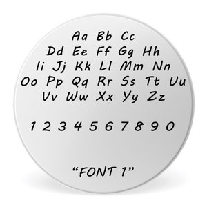 May include: A white circle with black text showing the alphabet in uppercase letters and numbers 1 through 0. The text at the bottom of the circle reads "FONT 1".