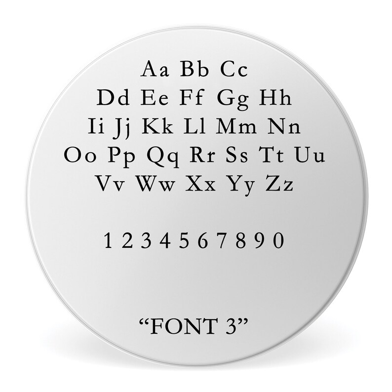 May include: A white circle with black text showing the alphabet in uppercase letters, numbers 1 through 0, and the text "FONT 3".