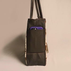 Spacious Large Cowhide Tote Bag with fringe! A Western Cowhide Purse perfect as a Cowhide Tote Shoulder Bag. Genuine Cowhide Leather Purse Bag, an ideal gift.
